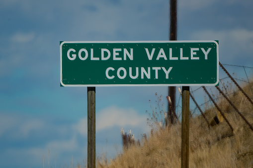 Golden Valley County sign on boundary in central Montana. USA