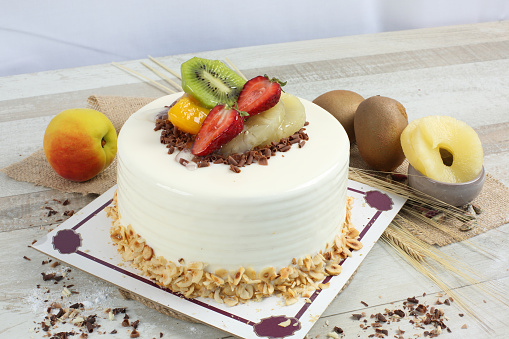 cake with kiwi,  pineapple, strawberry, peac and white chocolate