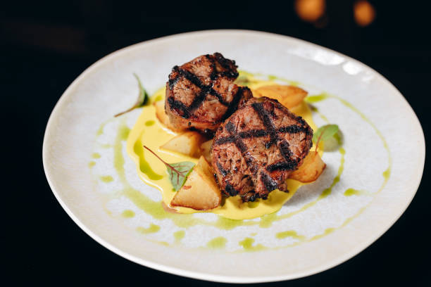 istock Veal medallion on a potato pillow, with cream sauce. 1479747501