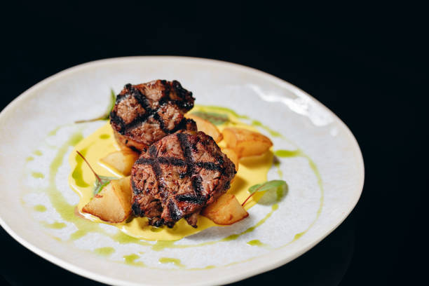 istock Veal medallion on a potato pillow, with cream sauce. 1479747504