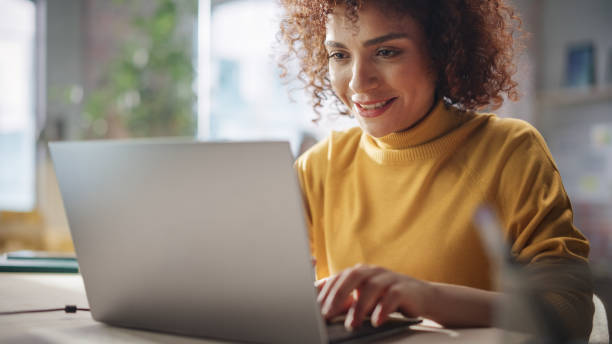 istock Middle Eastern Female Sitting in Creative Agency, Working on Implementing Modern Business Strategy for a Client. Successful Specialist Writing Corporate Project Plans on Laptop Computer. 1479753934