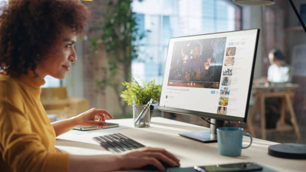 istock Middle Eastern Female Working in Creative Agency, Implementing Modern Business Strategy for Clients. Successful Specialist Using Computer, Watching Video about Cameras. 1479754074