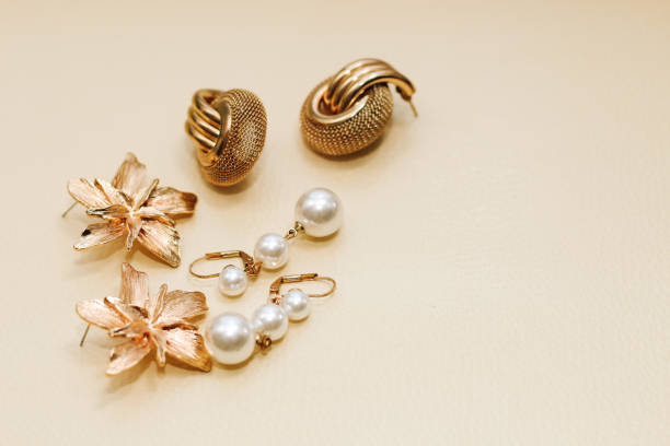 istock Gold ornaments from yellow metal on a light background 1479755633