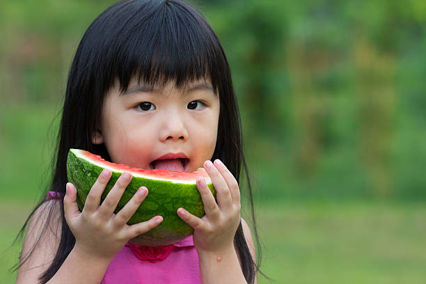 istock Happy child with watermelon 147975880