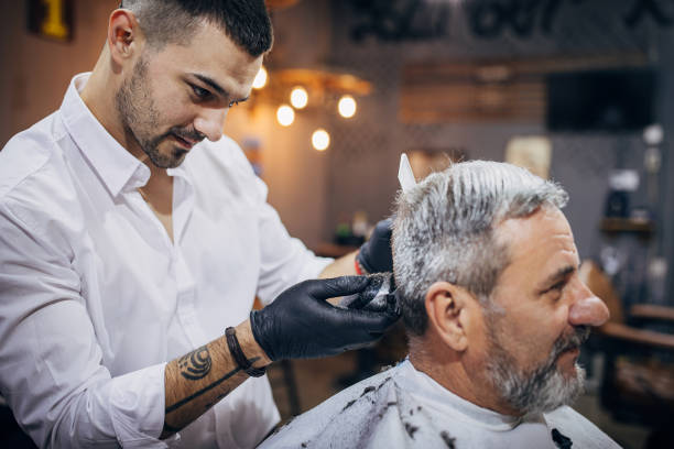 istock Barber cutting man's hair 1479759114