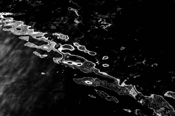 water surface making multiple water circles against blue background beauty product background, water-based concept.
