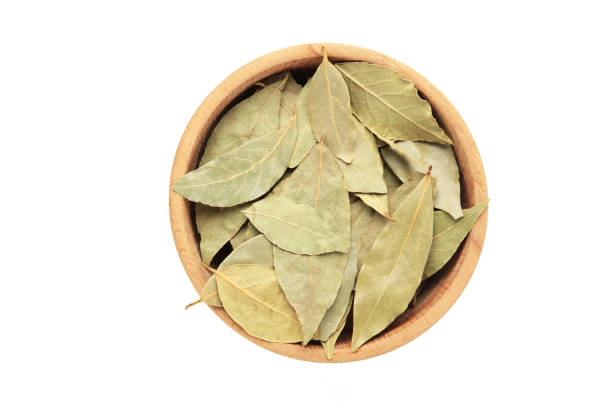 istock Bay leaves in bawl isolated on white background. 1479771114