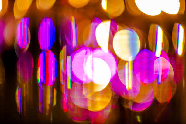 Traffic light at night, defocused bokeh light, blue color toned, abstract.