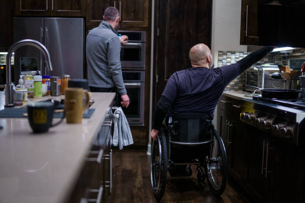 istock Man with a disability preparing a meal at home 1479772825