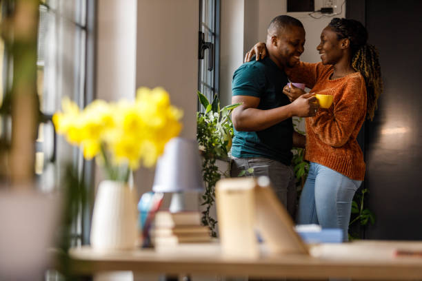 istock Young couple sharing affectionate moments while enjoying cups of coffee 1479777158