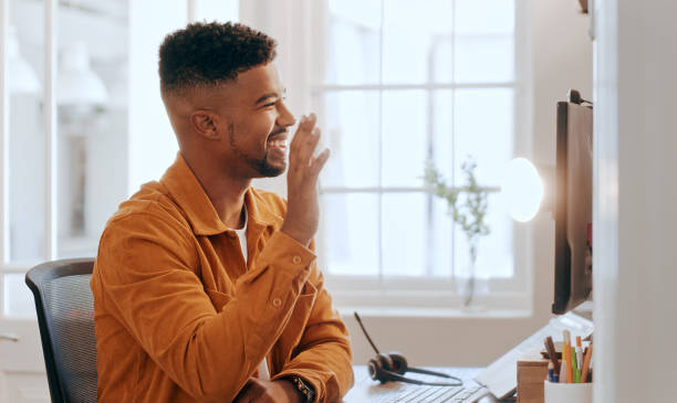 istock Serious young african businessman wear headset conference calling by webcam 1479777734