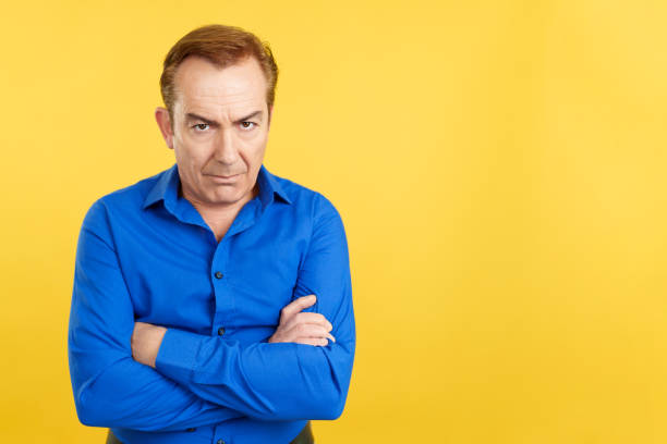 istock Mature man crossing the arms with an angry expression 1479778283
