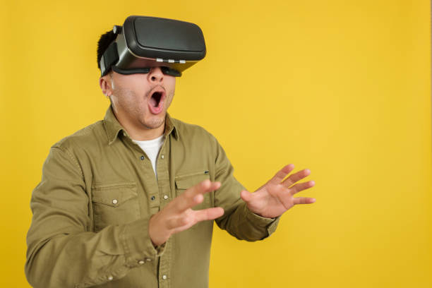 istock Surprised chinese man with Virtual Reality goggles 1479778307