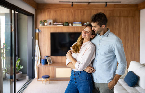 istock Loving couple smiling at home 1479781886