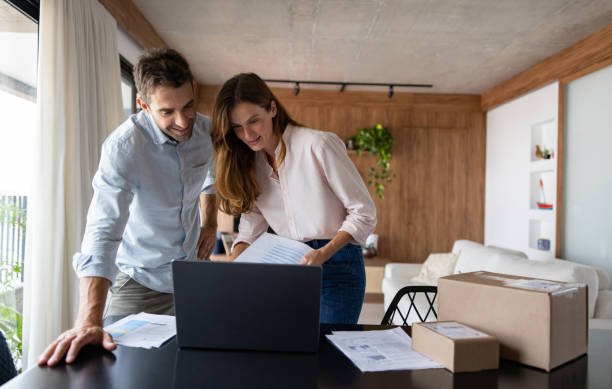 istock Happy couple running their e-commerce business from home 1479782318