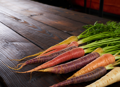 Special selection of different coloured carrots orange, purple and yellow.
