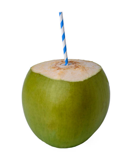 Green coconut with colored paper straw isolated on white background.