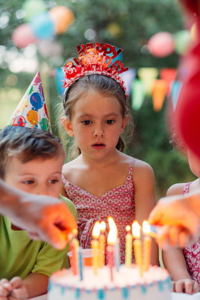 istock Parent’s hand lighting birthday candles 1479790059
