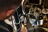 istock Barista Controlling Coffee Beans in Roasting Machine 1479792469