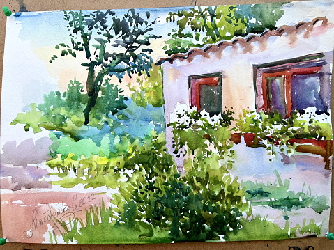 the picture is painted with paints on it depicts a house on the windowsill flowers and around a lot of greenery painting