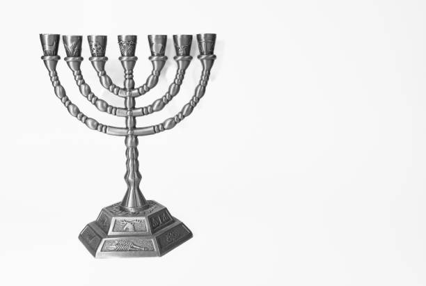 istock Ancient ritual candle menorah on a white background. Beautiful silver hanukkah menorah 1479794228