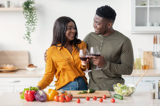 istock Cheers For Us. Romantic Black Couple Drinking Red Wine In Kitchen 1479794387