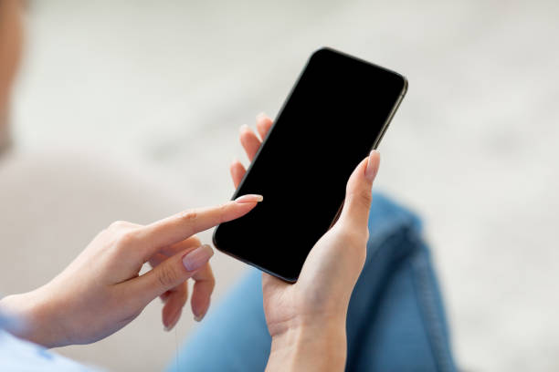 istock Unrecognizable woman using smartphone with blank screen, mockup 1479795547
