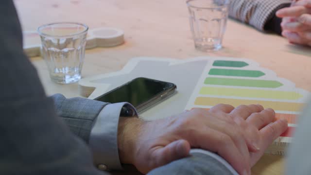 energy pass logo and male hands at office meeting