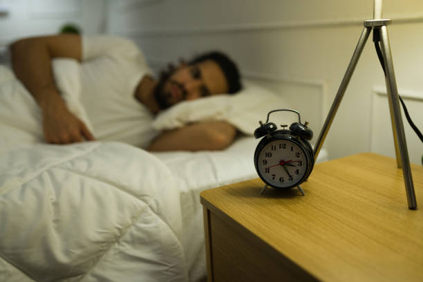 istock Upset man trying to sleep late at night 1479808507