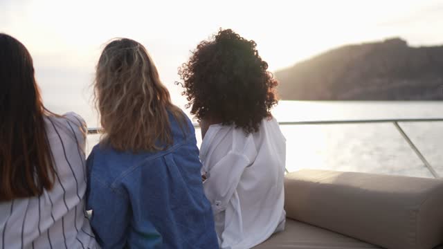 Young women contemplating on a yacht