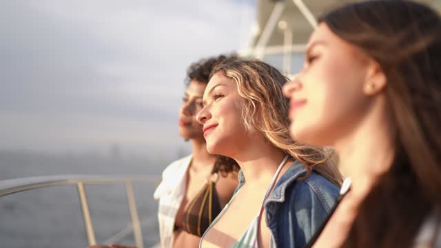 Young women contemplating on a yacht