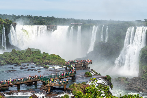 Tourists at Iguazu Falls, one of the world's great natural wonders, near the border of Argentina and Brazil.