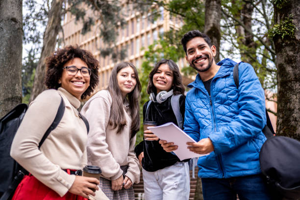 istock Portrait of young university students outdoors at university 1479826964
