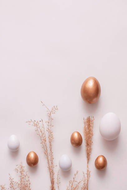 istock Top view of easter eggs colored with golden paint in differen patterns. White background. Copy space. 1479828925