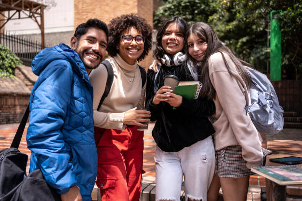 istock Portrait of young university students outdoors at university 1479829049