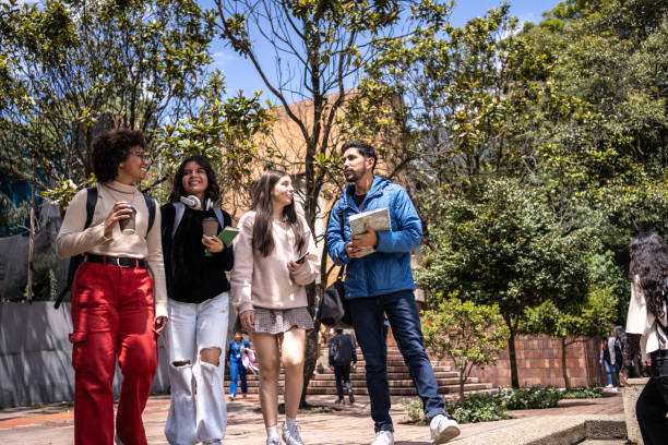 istock Young university students walking while talk outdoors 1479829066