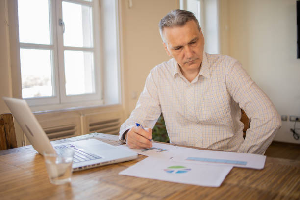 istock Mature fashionable man working at home 1479835080