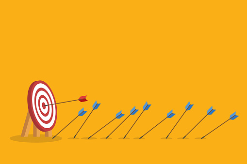 Blue arrows missed hitting target and only red one hits the center. Business challenge failure and success concept.