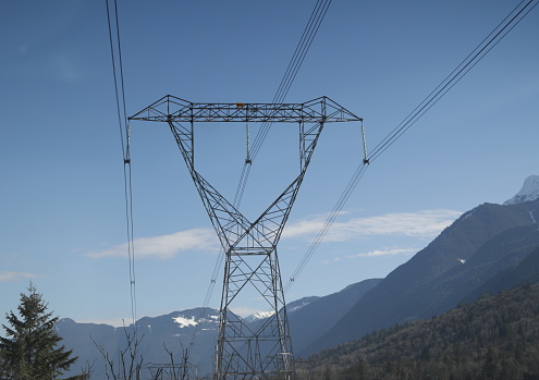 Power lines extend over the Trans-Canada Highway in Chilliwack, British Columbia. Spring morning in the Fraser Valley Regional District.