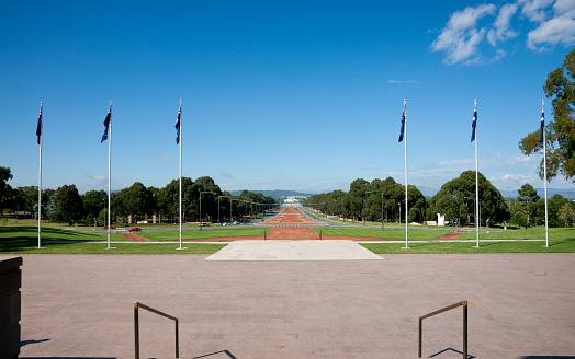 Red topped Anzac Parade from war memorial in Canberra Australia in January 2011.