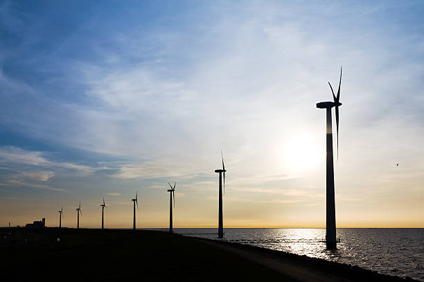 istock Wind turbine sunset lake 147985279