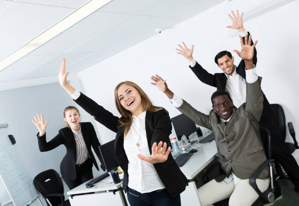 istock Group of business people celebrating victory 1479854216