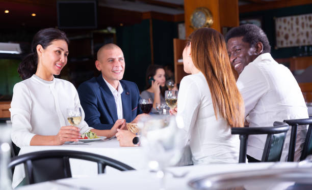 istock positive clients eating and drinking in cafe 1479854635