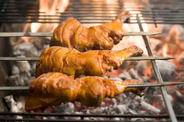 Meat grilling on charcoal. chicken breat stock image