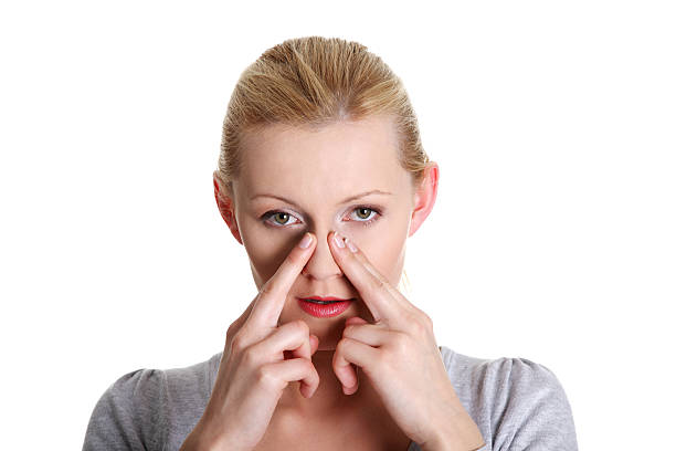 istock Woman with hands over her nose feeling pain 147986693