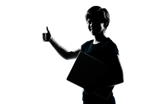 one caucasian young teenager silhouette boy girl holding carrying laptop computer thumb up portrait in studio cut out  on white background