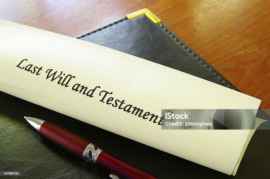 Last will and testament with red pen on desk Last Will and Testament document on desk Mansion Stock Photo