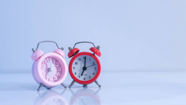 istock pink and red alarm clocks 1479872235