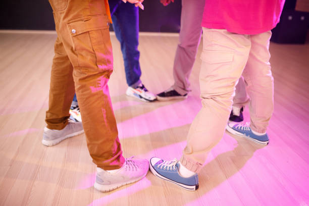 istock Group of friends making a circle with their sneakers touching 1479874927