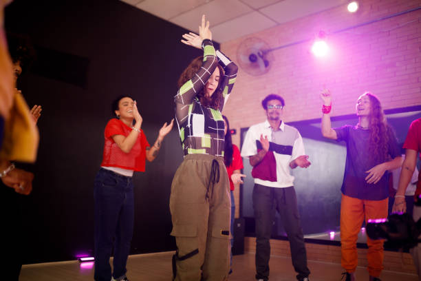 istock Energetic girl dancing with her friends 1479875088